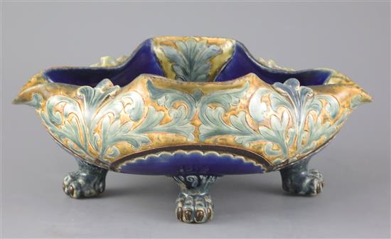 Frank A Butler for Doulton, a rare quatrefoil dish on four paw feet, dated 1882, W. 28cm, restoration